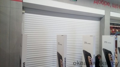 Захисні ролети на вхідну групу в магазин побутових товарів «Ельдорадо», м.  Нова Каховка, вул.  Французька (вул. Паризької комуни), будинок № 55 — ДНІПРОКОМПЛЕКСБУД Захисні ролети на вхідну групу в магазин побутових товарів «Ельдорадо», м.  Нова Каховка, вул.  Французька (вул. Паризької комуни), будинок № 55 — ДНІПРОКОМПЛЕКСБУД