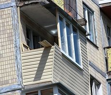 Внешняя обшивка балкона сайдингом в Киеве