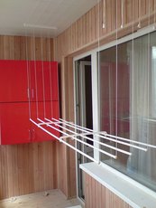 Балконный деревянный шкаф обшитый пластиком